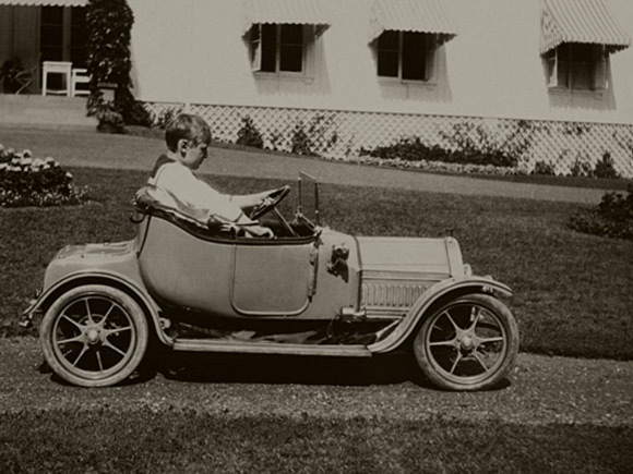 Crown Prince Olav in his electric Baby Cadillac at Bygdø Royal Farm. Photo: The Royal Court Photo Archive.